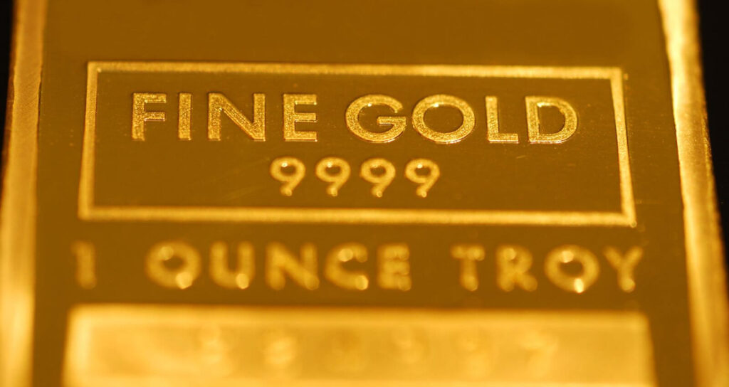 Close-up of a 1 troy ounce fine gold bar stamped 9999 purity